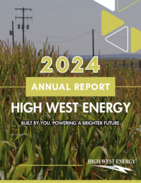 The 2024 Annual Report for High West Energy, featuring a cornfield in the foreground and power lines in the background. The report's title and slogan "Built by You, Powering a Brighter Future" are prominently displayed.
