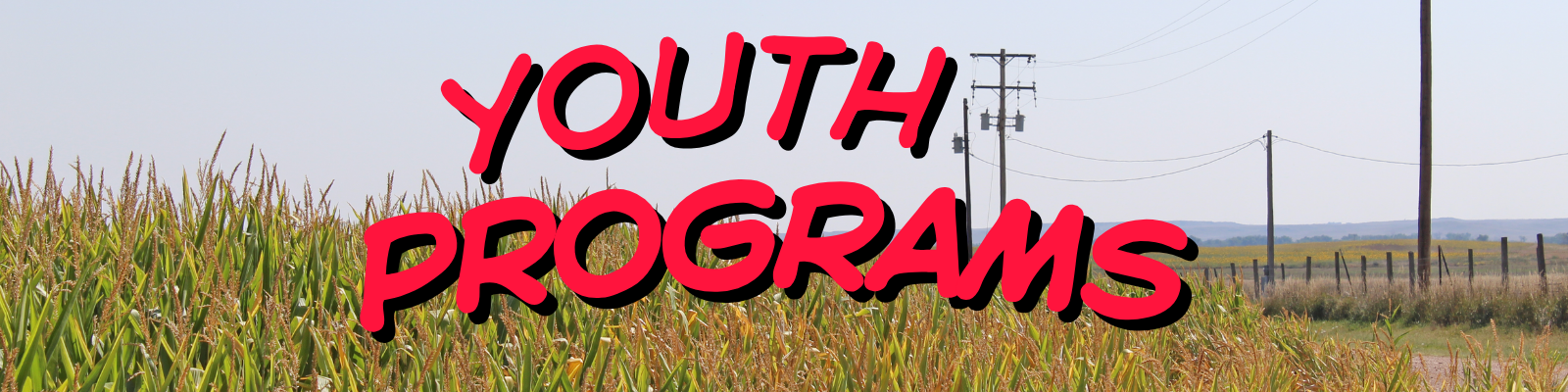 Youth Programs banner featuring a rural cornfield, utility poles, and power lines with the words ‘Youth Programs’ displayed in large red lettering.